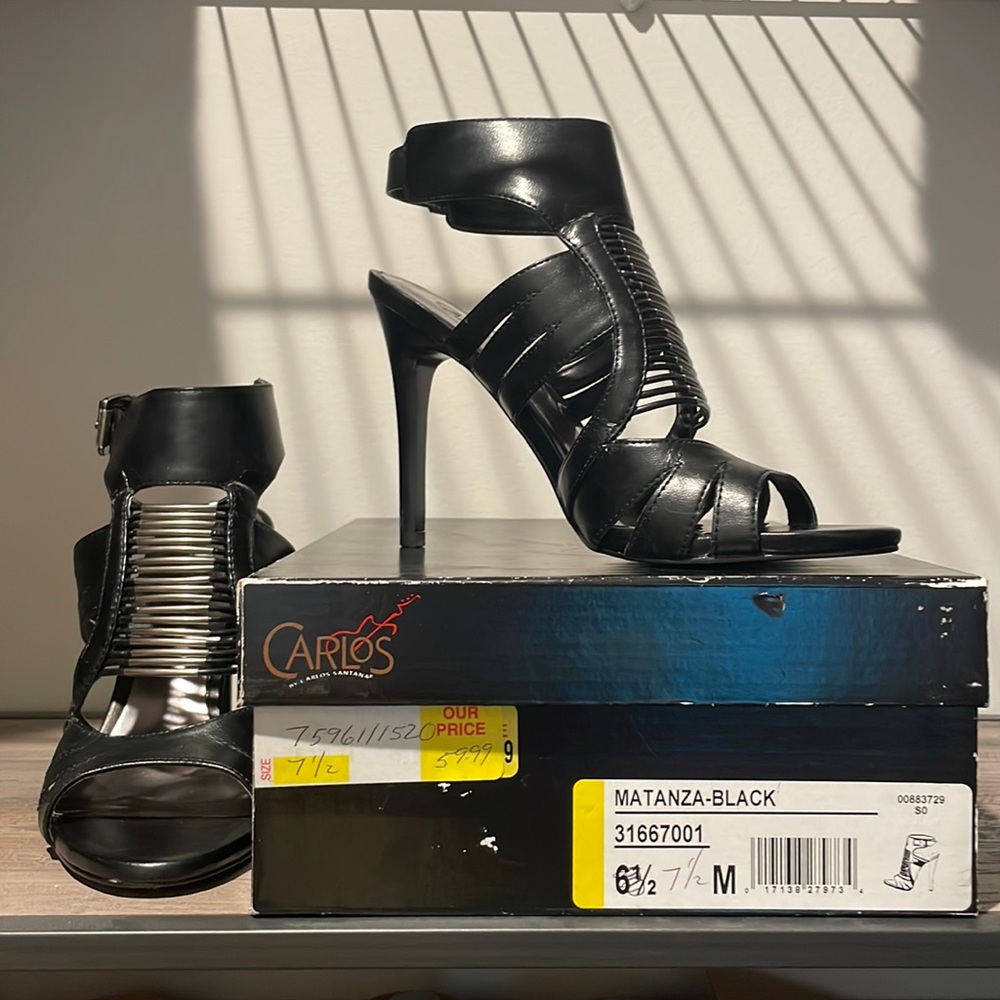 Black and silver strappy open toed heel.  Very gently used, original box.